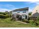 A spacious backyard features a screened-in porch and well-maintained lawn at 7 Faircroft Ct, Durham, NC 27703