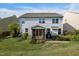 Two-story home featuring a screened-in porch, grill and manicured backyard at 7 Faircroft Ct, Durham, NC 27703