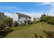Home featuring a screened-in porch and spacious lawn on a clear day at 7 Faircroft Ct, Durham, NC 27703