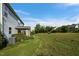 A spacious backyard with a well-maintained lawn and established shrubbery at 7 Faircroft Ct, Durham, NC 27703