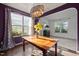 Inviting dining room featuring a wood table, stylish decor and natural light at 7 Faircroft Ct, Durham, NC 27703