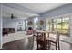 Cozy living area featuring fireplace, plush seating, and access to a screened-in porch at 7 Faircroft Ct, Durham, NC 27703