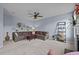Bright and airy living room with a ceiling fan and an L-shaped sofa at 7 Faircroft Ct, Durham, NC 27703