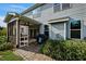 Home featuring a screened-in porch, outdoor grill and brick patio at 7 Faircroft Ct, Durham, NC 27703