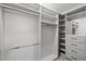 White walk-in closet with custom shelving and drawers for optimal organization at 7 Faircroft Ct, Durham, NC 27703