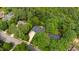 Charming home surrounded by mature trees, with a long driveway and easy street access at 7620 Rainwater Rd, Raleigh, NC 27615