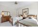 This bedroom features two twin beds, neutral walls, and wooden furniture at 7620 Rainwater Rd, Raleigh, NC 27615