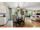 Bright dining room leads into the kitchen and sunroom of this home at 7620 Rainwater Rd, Raleigh, NC 27615