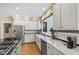 Bright kitchen with stainless appliances and a window over the sink at 7620 Rainwater Rd, Raleigh, NC 27615