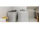 Bright laundry room with new, modern washer and dryer appliances at 7620 Rainwater Rd, Raleigh, NC 27615