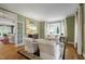 Bright living room featuring elegant furnishings, large windows, and hardwood floors at 7620 Rainwater Rd, Raleigh, NC 27615