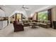 Spacious living room area with a comfortable seating area, a small kitchenette and ample natural light at 7620 Rainwater Rd, Raleigh, NC 27615