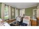 Stylish living room showcasing hardwood floors, large windows, and elegant seating at 7620 Rainwater Rd, Raleigh, NC 27615