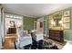 Sophisticated living room with hardwood floors, large windows, and elegant decor at 7620 Rainwater Rd, Raleigh, NC 27615