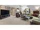 Cozy living room features an entertainment center, comfortable seating and a small kitchenette at 7620 Rainwater Rd, Raleigh, NC 27615