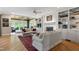 Bright living room with fireplace, built-ins, hardwood floors and neutral furniture at 7620 Rainwater Rd, Raleigh, NC 27615