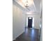 Bright foyer with dark front door, wood floor, and crown molding welcomes you into the home at 776 Shadetree Rd, Benson, NC 27504