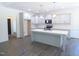 Modern kitchen with gray cabinets, quartz countertops, stainless steel appliances, and an island at 776 Shadetree Rd, Benson, NC 27504
