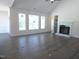 Open living room with large windows, a fireplace, and ample natural light at 776 Shadetree Rd, Benson, NC 27504