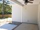 A covered patio with a ceiling fan, perfect for outdoor relaxation and entertaining at 776 Shadetree Rd, Benson, NC 27504