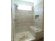 Newly-tiled walk-in shower featuring a mosaic accent stripe and built-in niche at 776 Shadetree Rd, Benson, NC 27504