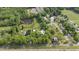 Stunning aerial view showcases the expansive property featuring lush greenery, a pond, and buildings at 7920 E Washington St, Mebane, NC 27302