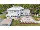 Aerial view showcases an expansive backyard with patio, pergola, and manicured lawn at 7920 E Washington St, Mebane, NC 27302