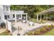 A pristine backyard with manicured lawns, lush gardens, and outdoor seating arrangements at 7920 E Washington St, Mebane, NC 27302