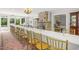 Spacious dining area featuring a stone fireplace and large windows with outside views at 7920 E Washington St, Mebane, NC 27302