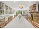 Bright dining area with large windows, stone fireplace, and seating for many at 7920 E Washington St, Mebane, NC 27302