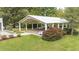 Open-air venue perfect for outdoor events, featuring bright red roses and green grass at 7920 E Washington St, Mebane, NC 27302