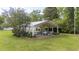 Aerial view of spacious outdoor event space with chandelier and manicured lawns at 7920 E Washington St, Mebane, NC 27302