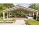 Beautifully designed outdoor event space with a white metal frame and elegant table settings at 7920 E Washington St, Mebane, NC 27302