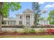 Charming two-story home with columned facade and landscaped yard at 7920 E Washington St, Mebane, NC 27302