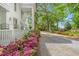 Beautiful home exterior featuring a well-manicured lawn and vibrant flowerbeds at 7920 E Washington St, Mebane, NC 27302