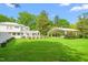 Picturesque white home with a large, landscaped lawn and an event pavilion for outdoor celebrations at 7920 E Washington St, Mebane, NC 27302