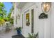 Inviting front porch showcasing vintage lighting, outdoor seating, and tasteful decor at 7920 E Washington St, Mebane, NC 27302