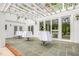 Charming patio with bistro tables and a pergola, perfect for outdoor gatherings and enjoying the serene ambiance at 7920 E Washington St, Mebane, NC 27302