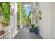 Inviting front porch featuring slate flooring, potted plants, and pendant lighting at 7920 E Washington St, Mebane, NC 27302