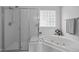 Bathroom showcasing a shower and a large soaking tub with a window at 8 Summertime Ct, Durham, NC 27707