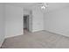 Bedroom with neutral walls, carpet, closet, and access to the hallway at 8 Summertime Ct, Durham, NC 27707