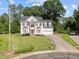 Attractive two-story home featuring a well-maintained lawn, dormer windows, and a two-car garage at 8 Summertime Ct, Durham, NC 27707
