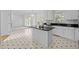 Well-appointed kitchen with granite countertops, a center island, and stainless steel appliances at 8 Summertime Ct, Durham, NC 27707