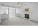 Bright living room offering neutral colors, fireplace and views to additional living spaces at 8 Summertime Ct, Durham, NC 27707