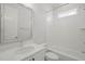 Bright bathroom featuring a shower over bath with white tile and a vanity with stone countertop at 815 Laurelwood Dr, Durham, NC 27705