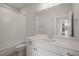 Bright bathroom featuring white cabinets, bathtub and shower at 815 Laurelwood Dr, Durham, NC 27705