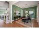 Stylish dining room features green walls, a modern light fixture, and a dark wood table with seating for four at 815 Laurelwood Dr, Durham, NC 27705