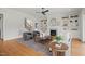 Cozy living room featuring a fireplace with built-in shelves, hardwood floors, and comfortable seating at 815 Laurelwood Dr, Durham, NC 27705