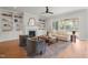 Bright living room features built-in shelving, a fireplace, plush seating, and a walk out to the porch at 815 Laurelwood Dr, Durham, NC 27705