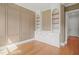 Office space featuring built-in shelves, decorative moulding and white cabinets at 815 Laurelwood Dr, Durham, NC 27705